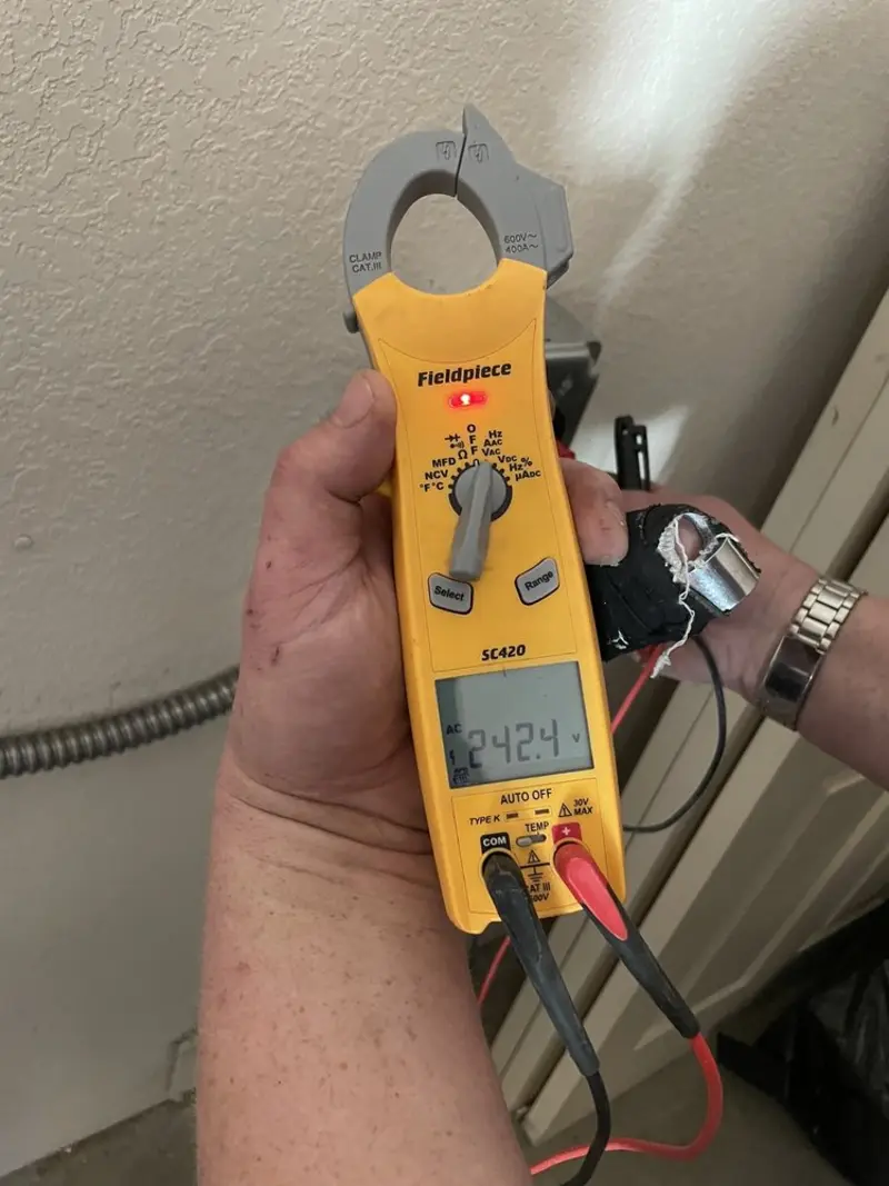 Voltage testing with clamp meter during Whole House Surge Protector in Reserve